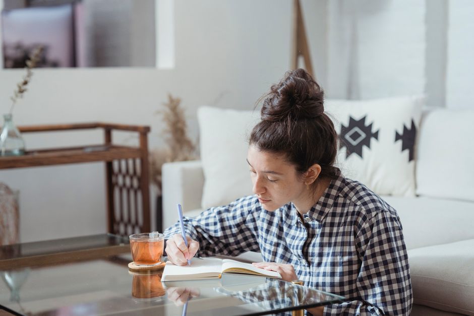 Woman planning her health goals at home